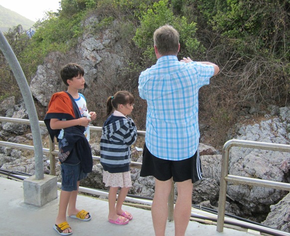 Bill, Leanna, and Dad explaining lava rock and island formation at Koh Larn, Thailand 2012